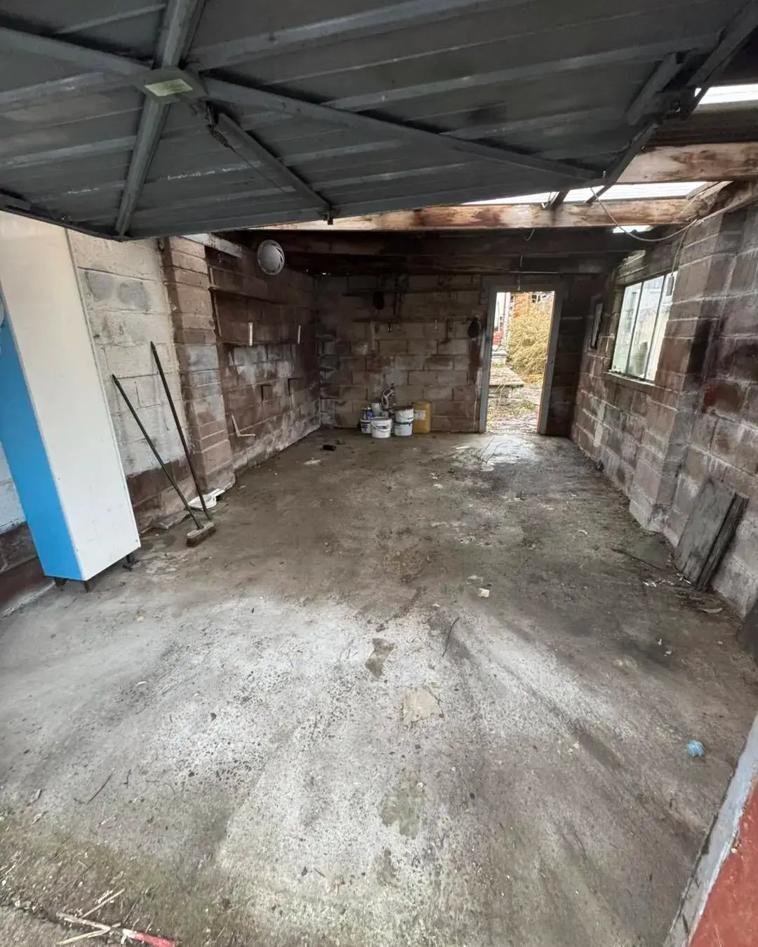 After: Garage clearance. Packed garage emptied and swept