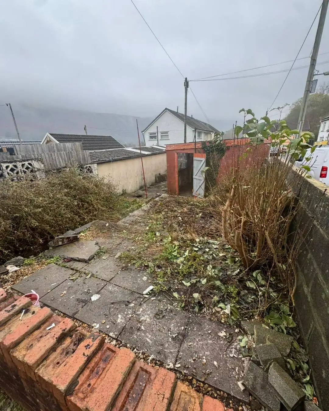 Cleared garden path with the South Wales valley behind